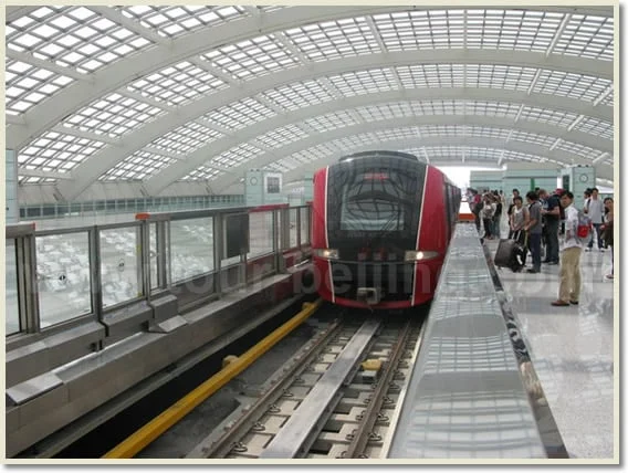 Red-fronted Airport Express train at Capital Airport Terminal 3