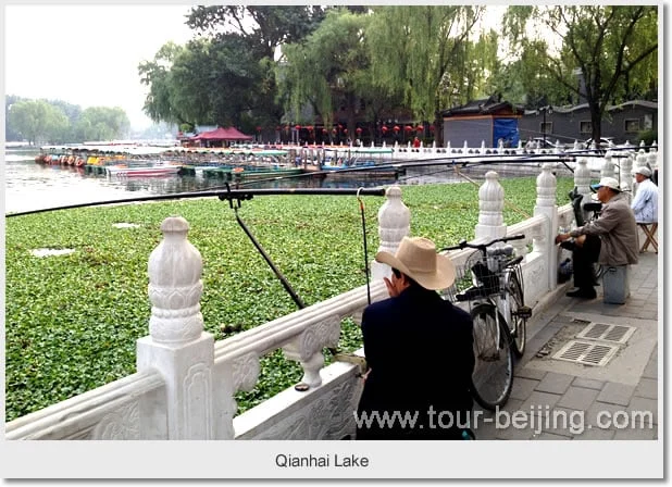 Qianhai lakeside railings, trees and people beside Shichahai
