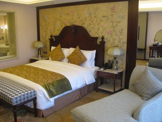 Double bed and seating area in a Beijing hotel room