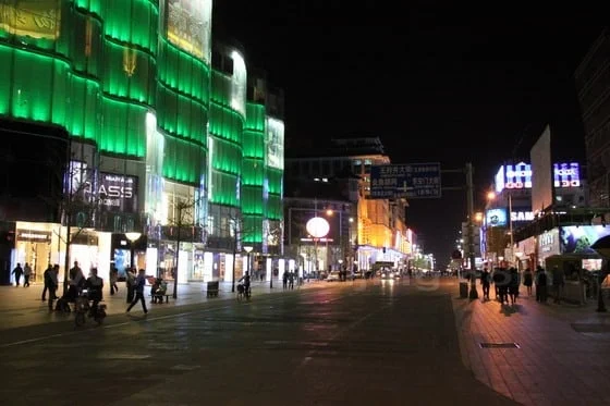 Illuminated shop fronts along Wangfujing pedestrian street