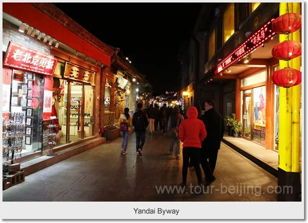 Lanterns and small shopfronts along Yandai Byway after dark
