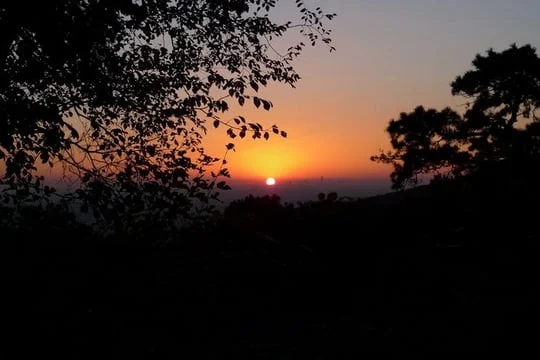Early morning light above the wooded ridges of Fragrant Hills