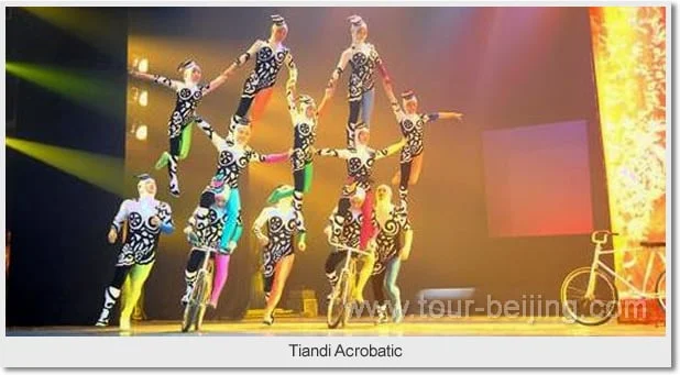 Acrobats balancing in an ensemble formation on stage