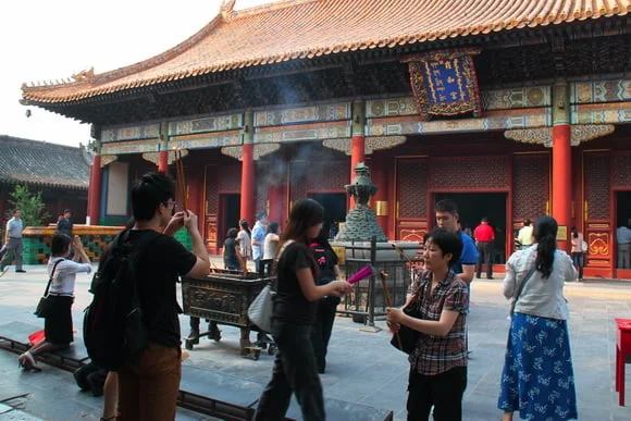 Visitors in front of Yonghe Palace hall at Beijing’s Lama Temple