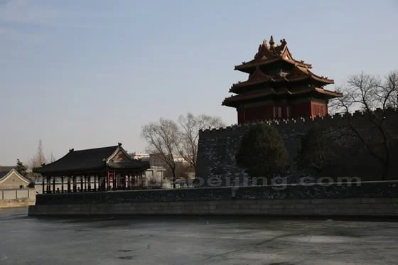 A corner tower of the Forbidden City beside its moat